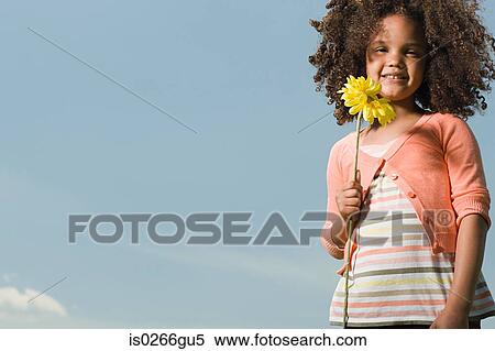 Girl with a flower View Large Photo Image Stock Photography - Girl with a flower. Fotosearch