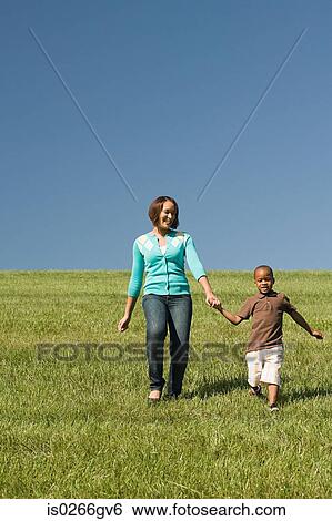 Mother and son in field View Large Photo Image Stock Photograph - Mother and son in field. Fotosearch