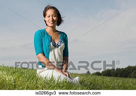 Woman in a field View Large Photo Image Stock Image - Woman in a field. Fotosearch