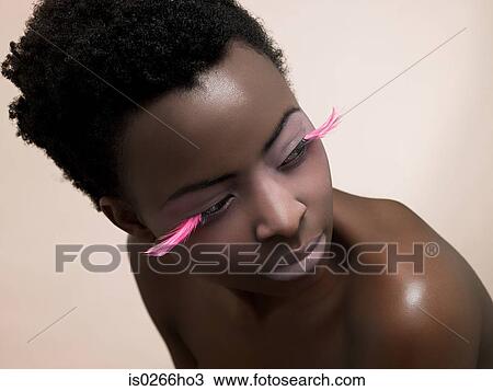 A woman wearing pink false eyelashes View Large Photo Image Stock Image - A woman wearing pink false eyelashes. Fotosearch