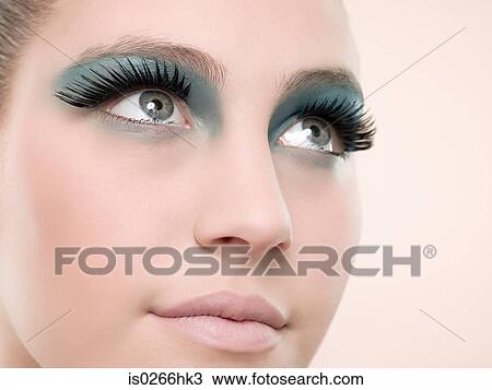 A young woman wearing false eyelashes View Large Photo Image Stock Image - A young woman wearing false eyelashes. Fotosearch