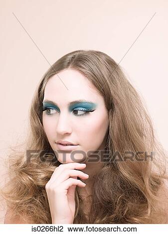A young woman wearing false eyelashes View Large Photo Image Stock Image - A young woman wearing false eyelashes. Fotosearch