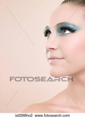 A young woman wearing false eyelashes View Large Photo Image Stock Image - A young woman wearing false eyelashes. Fotosearch