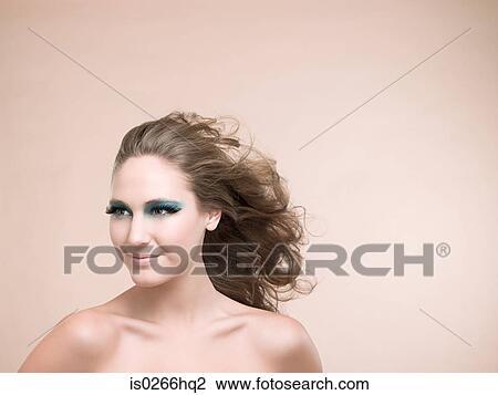 A young woman wearing false eyelashes View Large Photo Image Stock Image - A young woman wearing false eyelashes. Fotosearch