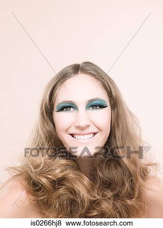 Stock Photo - A young woman wearing false eyelashes. Fotosearch