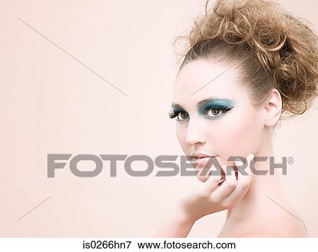 A young woman wearing false eyelashes View Large Photo Image Stock Photo - A young woman wearing false eyelashes. Fotosearch