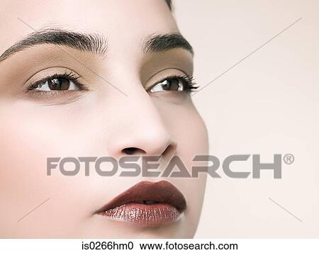Stock Image - Close up of a young womans face. Fotosearch