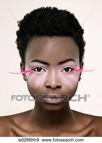 Portrait of a woman wearing pink false eyelashes View Large Photo Image Stock Photo - Portrait of a woman wearing pink false eyelashes. Fotosearch