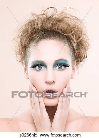 Portrait of a young woman wearing false eyelashes View Large Photo Image Stock Photography - Portrait of a young woman wearing false eyelashes. Fotosearch