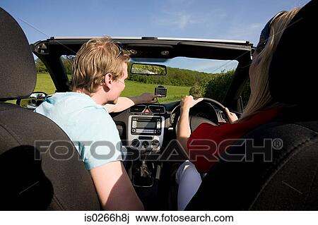A couple driving View Large Photo Image Stock Image - A couple driving. Fotosearch