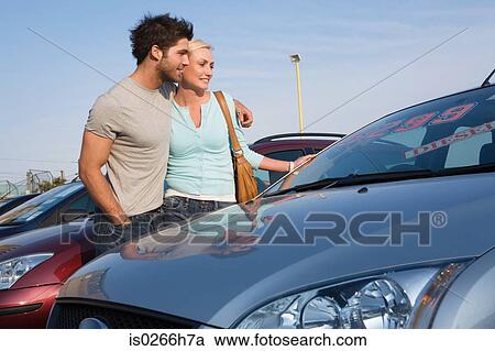 A couple looking at cars View Large Photo Image Stock Image - A couple looking at cars. Fotosearch