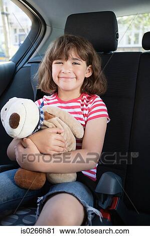 A girl holding a teddy bear View Large Photo Image Stock Image - A girl holding a teddy bear. Fotosearch