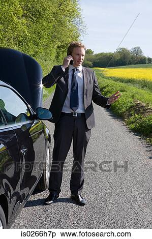 A man having automobile trouble View Large Photo Image Stock Photography - A man having automobile trouble. Fotosearch