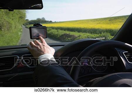 A man pointing to a gps View Large Photo Image Stock Image - A man pointing to a gps. Fotosearch