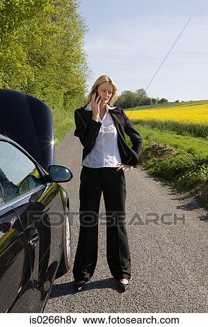 A woman using a cell phone View Large Photo Image Stock Photo - A woman using a cell phone. Fotosearch