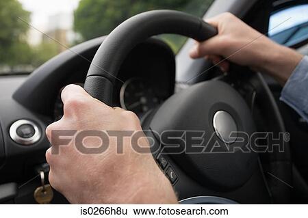 Hands on a steering wheel View Large Photo Image Stock Photograph - Hands on a steering wheel. Fotosearch