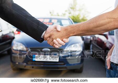 Two men shaking hands View Large Photo Image Stock Image - Two men shaking hands. Fotosearch