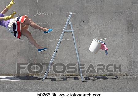 Stock Image - Woman falling off a ladder. Fotosearch