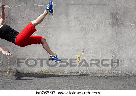 Woman falling on a banana skin View Large Photo Image Stock Image - Woman falling on a banana skin. Fotosearch