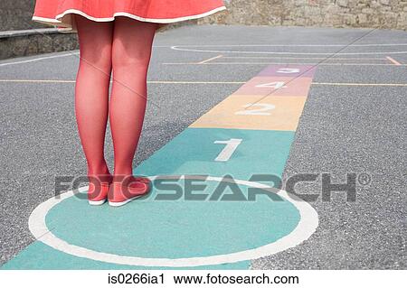 Woman playing hopscotch View Large Photo Image Stock Image - Woman playing hopscotch. Fotosearch