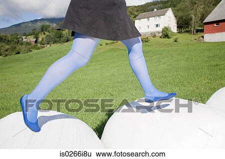 Woman running in a field View Large Photo Image Stock Photograph - Woman running in a field. Fotosearch
