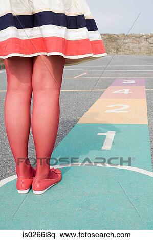 Young woman playing hopscotch View Large Photo Image Stock Photography - Young woman playing hopscotch. Fotosearch