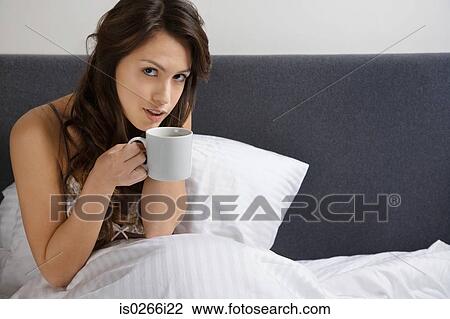 A woman holding cup View Large Photo Image Stock Image - A woman holding cup. Fotosearch
