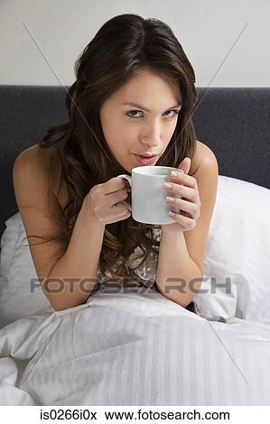 A woman holding cup View Large Photo Image Stock Photo - A woman holding cup. Fotosearch