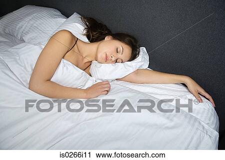 Stock Image - A woman sleeping. Fotosearch