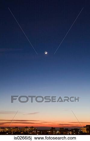 Stock Image - Moon in sky above hove. Fotosearch