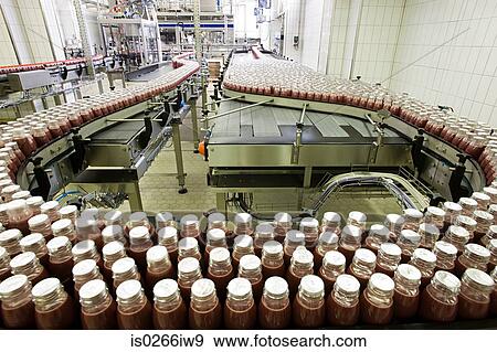 Bottled drinks being made in a factory View Large Photo Image Stock Photo - Bottled drinks being made in a factory. Fotosearch
