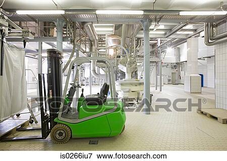 Forklift truck in a factory View Large Photo Image Stock Photo - Forklift truck in a factory. Fotosearch