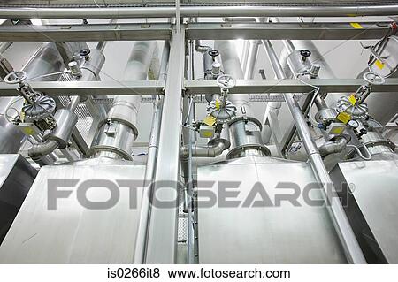 Low angle view of factory machinery View Large Photo Image Stock Photo - Low angle view of factory machinery. Fotosearch