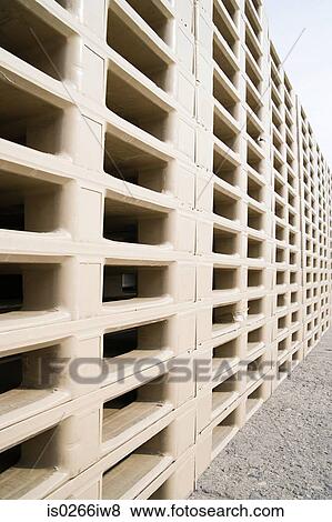 Pallets stacked in a row View Large Photo Image Stock Photo - Pallets stacked in a row. Fotosearch