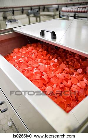 Red lids in a factory View Large Photo Image Stock Image - Red lids in a factory. Fotosearch