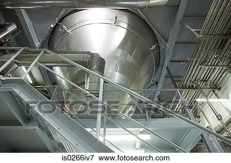 Stock Photo - Stainless steel machinery in a factory. Fotosearch