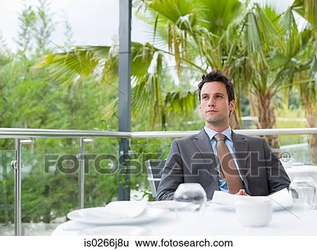 Stock Photograph - A businessman thinking. Fotosearch