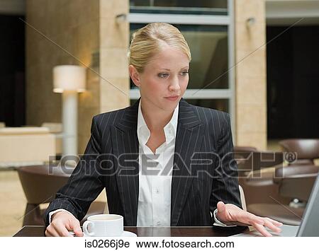 A businesswoman using a laptop View Large Photo Image Stock Image - A businesswoman using a laptop. Fotosearch