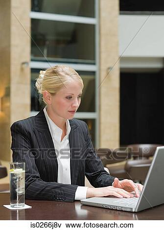 A businesswoman using a laptop View Large Photo Image Stock Photo - A businesswoman using a laptop. Fotosearch