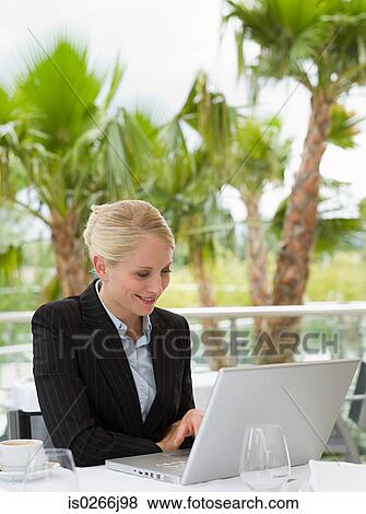 A businesswoman using a laptop View Large Photo Image Stock Photo - A businesswoman using a laptop. Fotosearch