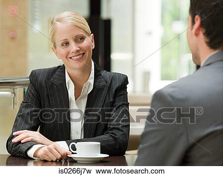 Business people face to face in a restaurant View Large Photo Image Stock Photo - Business people face to face in a restaurant. Fotosearch