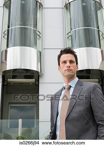 Portrait of a businessman outside a hotel View Large Photo Image Picture - Portrait of a businessman outside a hotel. Fotosearch
