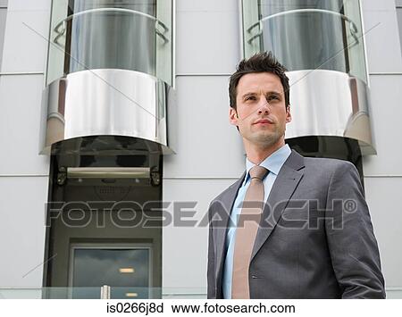 Portrait of a businessman outside a hotel View Large Photo Image Stock Image - Portrait of a businessman outside a hotel. Fotosearch