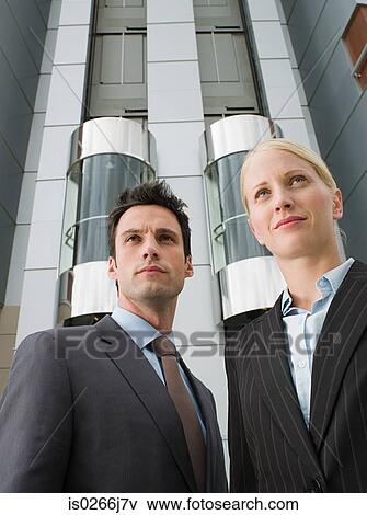 Portrait of two businesspeople outside a hotel View Large Photo Image Stock Photo - Portrait of two businesspeople outside a hotel. Fotosearch