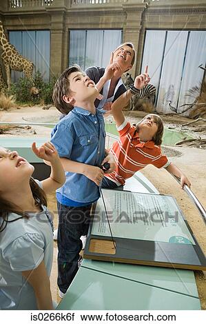 Mother with children in a museum View Large Photo Image Stock Image - Mother with children in a museum. Fotosearch