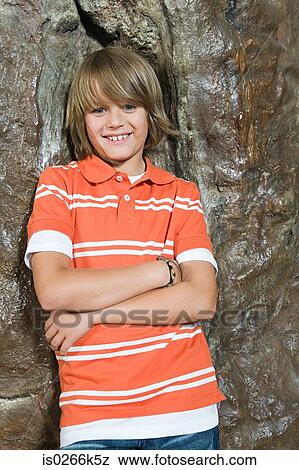 Portrait of a smiling boy View Large Photo Image Stock Photo - Portrait of a smiling boy. Fotosearch