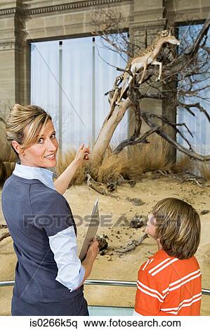 Teacher and pupil at a museum View Large Photo Image Stock Photography - Teacher and pupil at a museum. Fotosearch