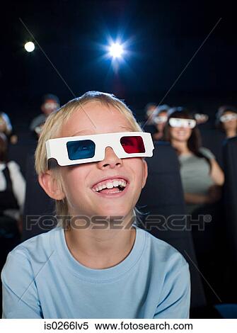 A boy watching a 3d movie View Large Photo Image Stock Photography - A boy watching a 3d movie. Fotosearch