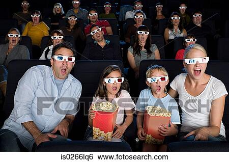 Stock Photograph - A cinema audience watching a 3d movie. Fotosearch