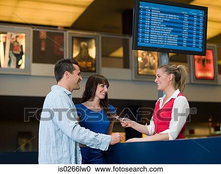 A couple buying tickets from the box office View Large Photo Image Stock Image - A couple buying tickets from the box office. Fotosearch